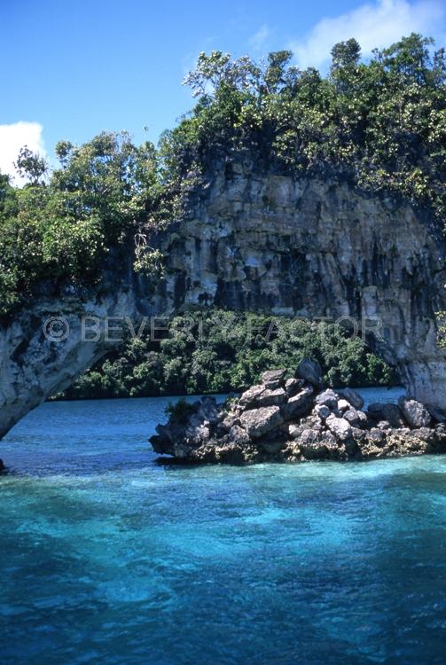 Island;Palau;arch;rocks;green;trees;blue water